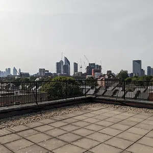 High-ceiling Flat With Rooftop & Skyline View Apartment